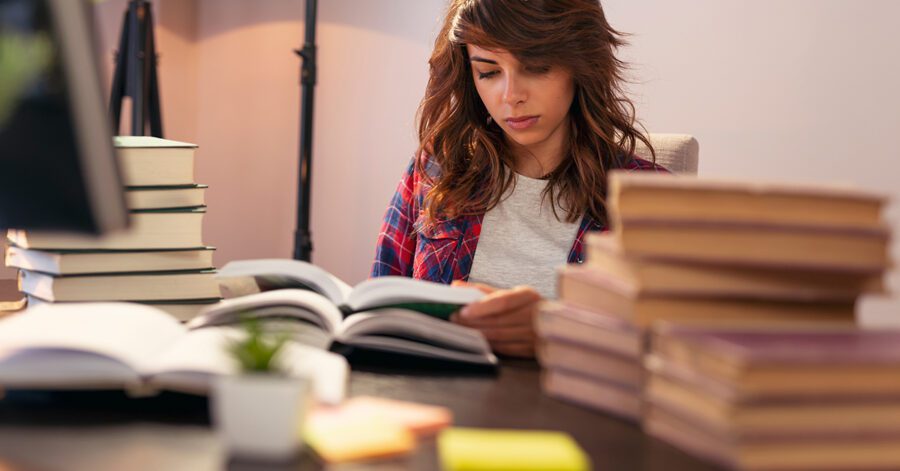 A homeschool student studying Latin with textbooks.