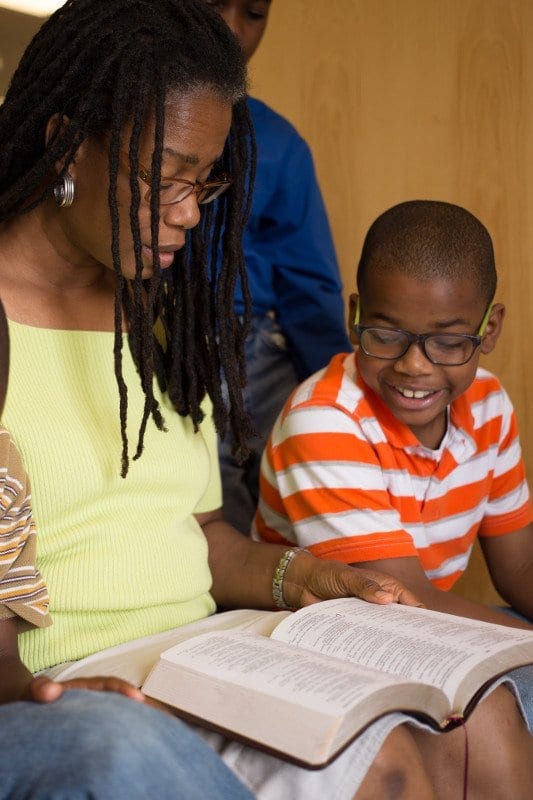 A Foundations homeschool mom reads aloud to her son.