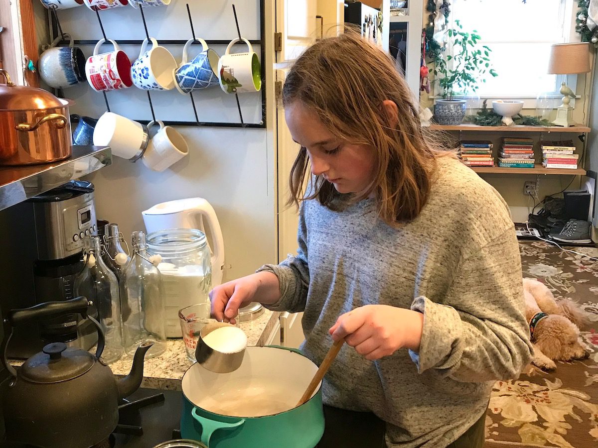 A student conducts an experiment for science fair.