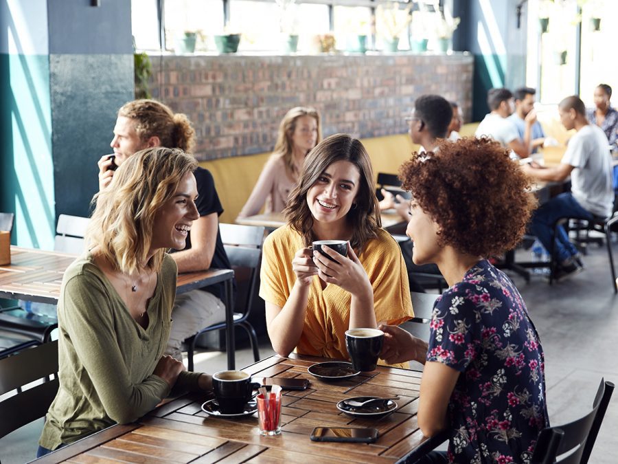 A group welcomes a new student.
