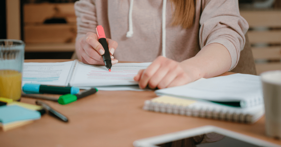 A student highlights text.