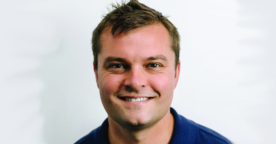 Robert Bortins profile shot smiling at the camera