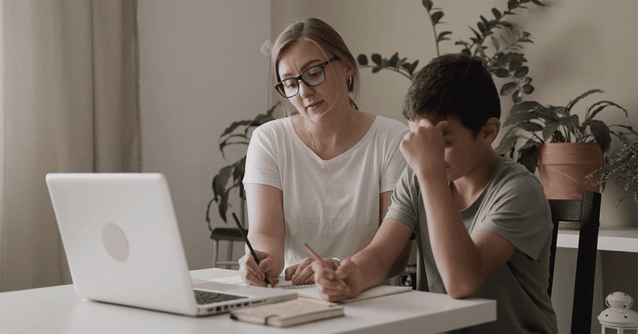 A mother practices what she's learned through the Classical Learning Cohort with her son.