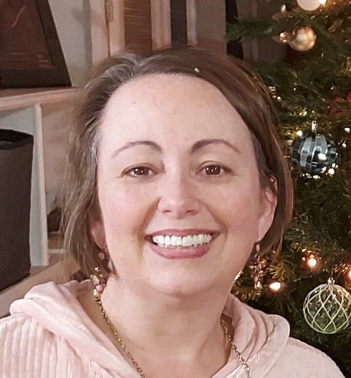 Theresa Broussard smiling at the camera