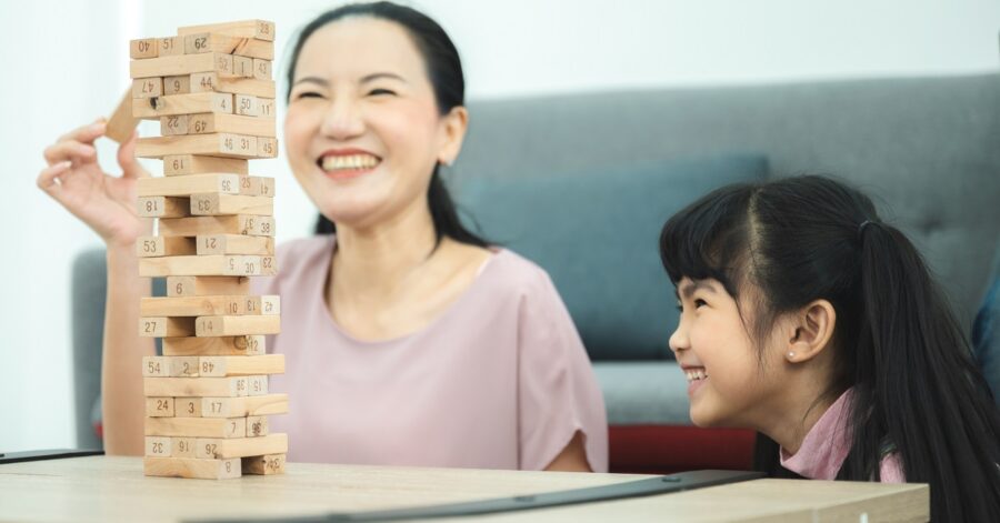 Homeschool Balance: a mother and a daughter play a balancing game.