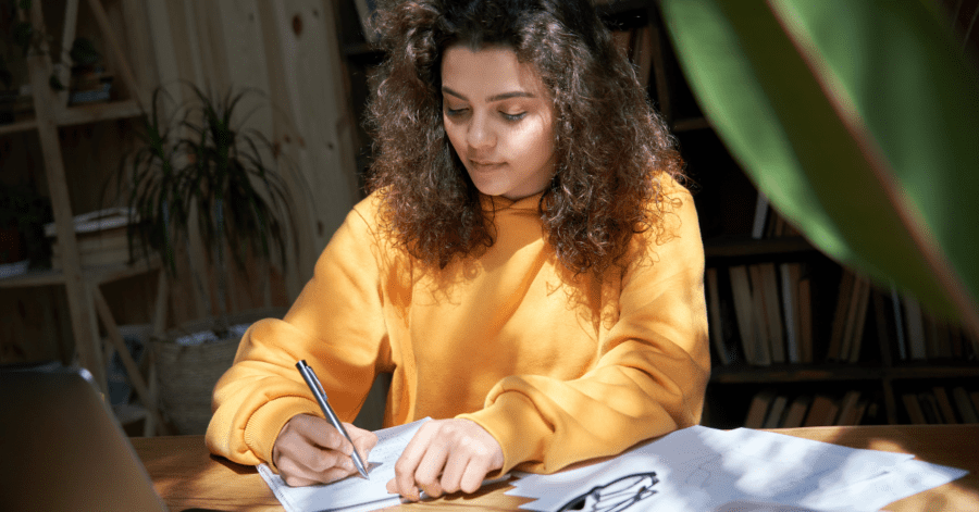 A high school homeschooler studies.