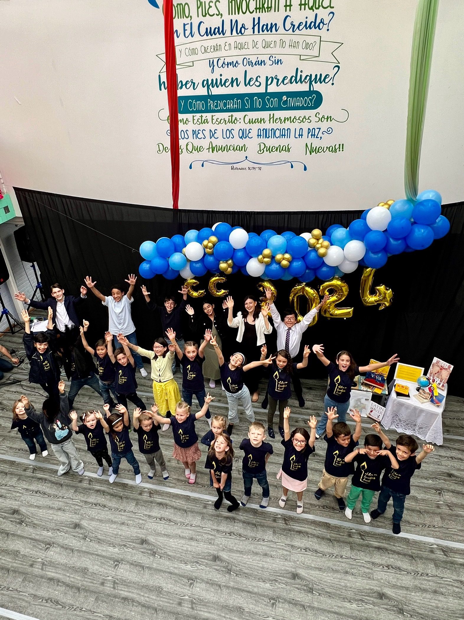 Overhead photo of kids waving 